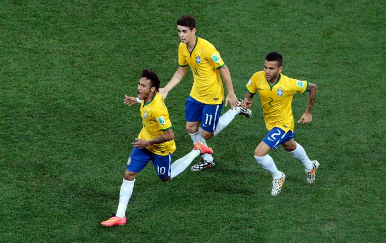 Brazil's Neymar, left, celebrates scoring his side's first goal during the group A World Cup soccer match between Brazil and Croatia, the opening game of the tournament, in the Itaquerao Stadium in Sao Paulo, Brazil, Thursday, June 12, 2014.  (AP Photo/Shuji Kajiyama)
