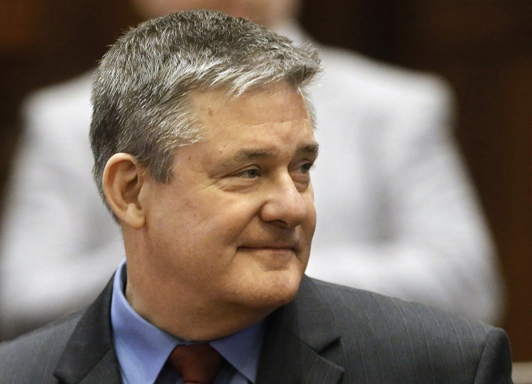 FILE - In this Jan. 29, 2014 file photo, Illinois state Treasurer Dan Rutherford is seen in the House chambers at the state Capitol in Springfield Ill. The Associated Press has learned that Rutherford fired three top administrators after an investigation by the treasurer's inspector general. Letters from Rutherford's office obtained by the AP indicate Patrick Carlson, George Daglas and Ashvin Lad were dismissed July 2, 2014. Each was dismissed for allegedly violating timekeeping policies and falsifying records. The letter to Carlson says he also violated rules against 