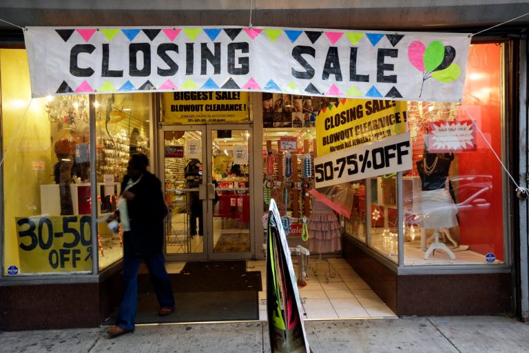   In this Tuesday, Dec. 18, 2012 photo, a person exits a business with a 