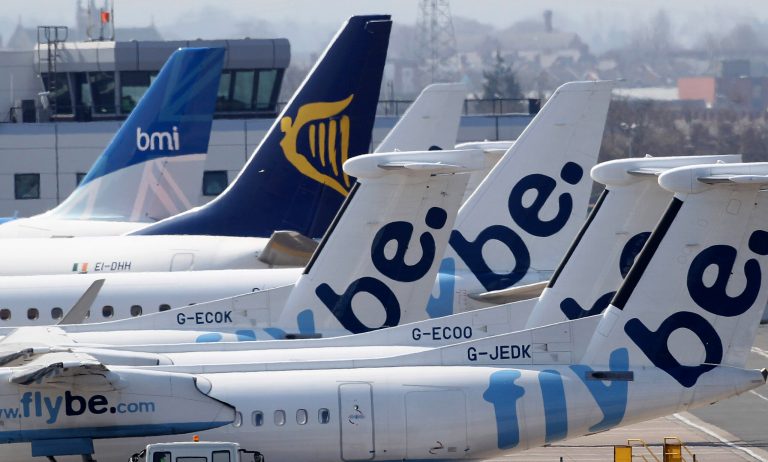 FILE - In this Thursday, April 15, 2010 file photo, grounded aircraft are seen at Belfast City airport, Northern Ireland. Passengers on European airlines may soon be able to use portable electronics including cell phones and tablet computers any time during flights, under new safety guidelines issued Friday, Sept. 26, 2014. The Cologne-based European Aviation Safety Agency said that starting immediately, European airlines can, at their own discretion, allow passengers to leave electronics on the entire flight, without the putting them into 