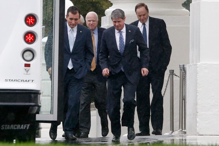 Republican senators, from left, Ted Cruz of Texas, John McCain of Arizona, David Vitter of Louisiana, and Richard Shelby of Alabama, walk in the rain back to their bus at the North Portico of the White House in Washington. (AP/Charles Dharapak)