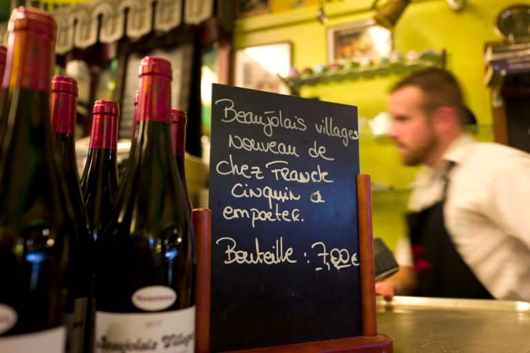 A young bartender behind the bar (AP Photo/Michel Spingler).