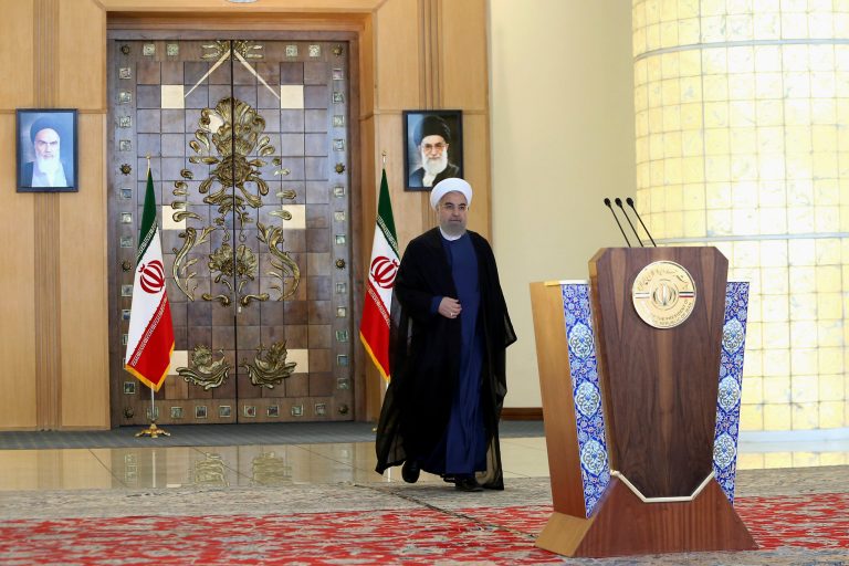 Iran's president Hassan Rouhani arrives for an address to the nation after a nuclear agreement was announced in Vienna on July 14. World powers and Iran struck a historic deal to curb Iran's nuclear program in exchange for billions of dollars in relief from international sanctions. (AP Photo/Ebrahim Noroozi)