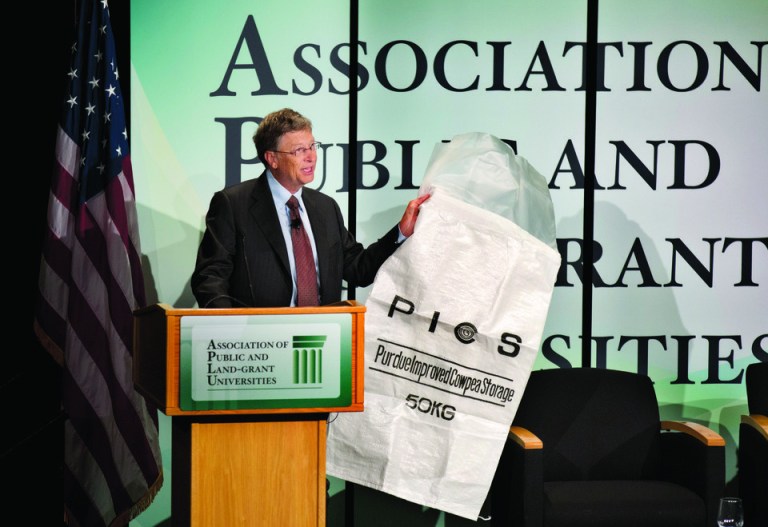 Bill Gates uses big plastic bag to cheer on public universities