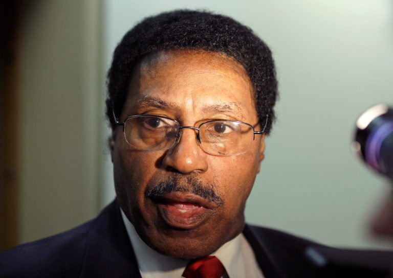 FILE--In this March 26, 2014 file photo, Assemblyman William Scarborough, D-Queens, talks to reporters outside his office in the Legislative Office Building in Albany, N.Y. Scarborough has been charged, Wednesday, Oct. 1, 2014, by authorities with using his campaign funds for personal expenses. (AP Photo/Mike Groll, File)