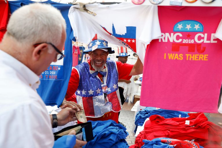 A street vendor sells campaign shirts in downtown, Thursday, July 21, 2016, in Cleveland, during the final day of the Republican convention. (AP Photo/John Minchillo)