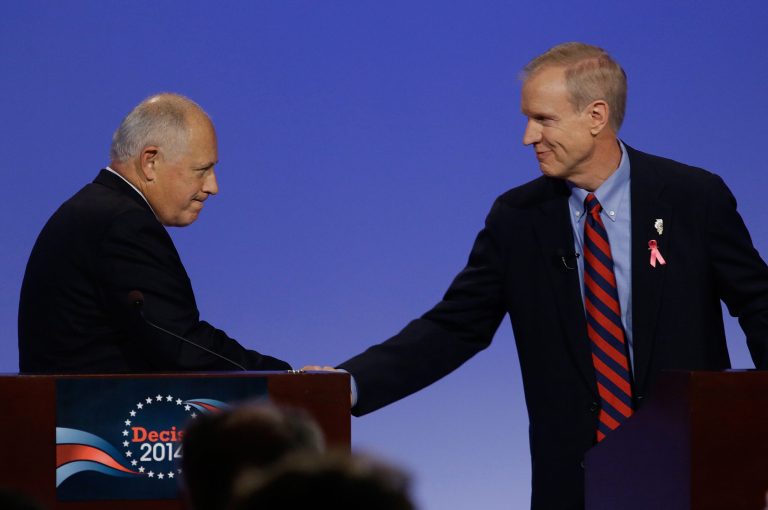Democratic Illinois Gov. Pat Quinn, left, and Illinois Republican gubernatorial candidate businessman Bruce Rauner right, shake hands after the first televised debate Thursday, Oct.  9, 2014, in Peoria Ill. (AP Photo/Seth Perlman)