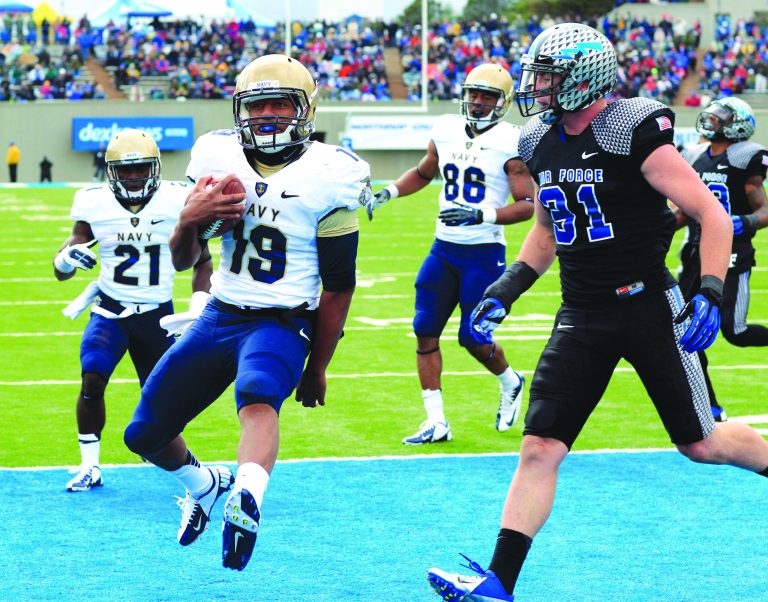 David Zalubowski/AP
Keenan Reynolds replaced injured quarterback Trey Miller and led Navy to an overtime victory over Air Force on Saturday.