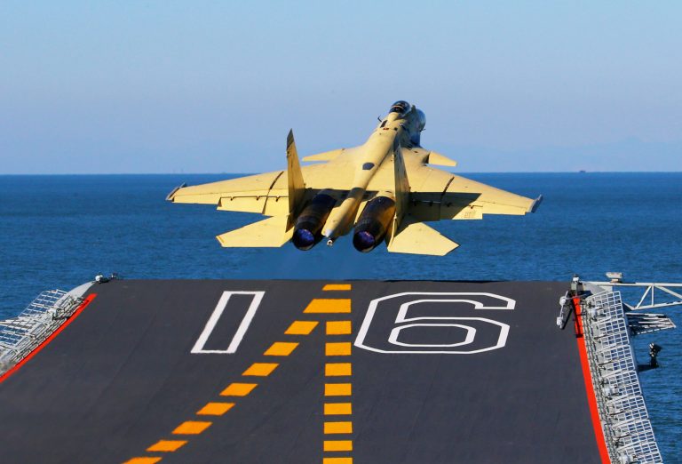 In this undated photo released by China's Xinhua News Agency, made available on Sunday, Nov. 25, 2012, a carrier-borne J-15 fighter jet takes off from China's first aircraft carrier, the Liaoning. (AP Photo/Xinhua, Zha Chunming)
