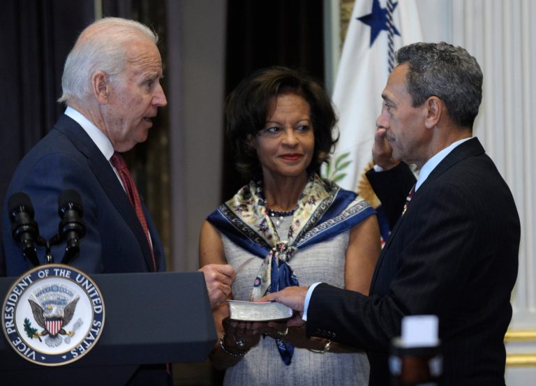Vice President Joe Biden administers the oath of office to Mel Watt as director of the Federal Housing Finance Agency during a ceremonially swearing-in ceremony, Monday, Jan. 6, 2014, in the Eisenhower Executive Office Building on the White House complex in Washington. Watt's wife, Eulada Watt watches at center. (AP Photo/Susan Walsh)