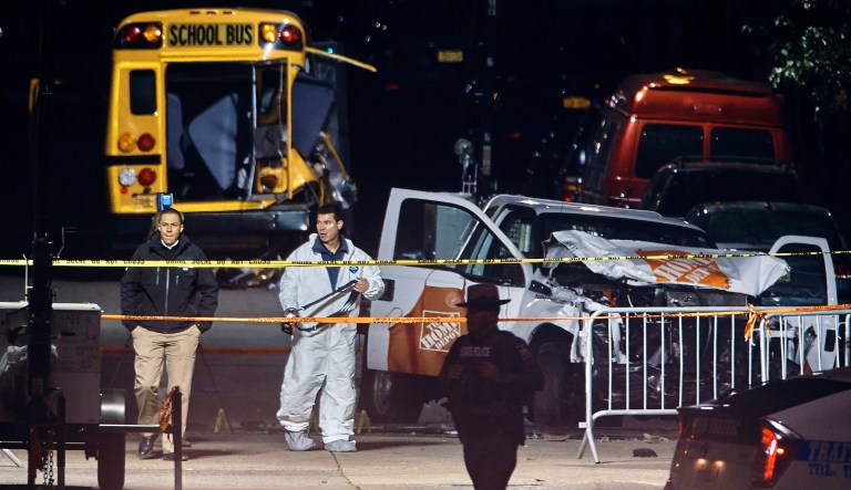 Police work near a damaged Home Depot truck after a motorist drove onto a bike path near the World Trade Center memorial, striking and killing several people. (AP Photo/Andres Kudacki)