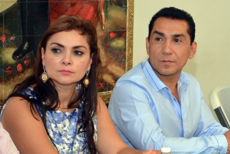 In this May 8, 2014, file photo, the mayor of the city of Iguala, Jose Luis Abarca and his wife, Maria de los Angeles Pineda, meet with state government officials in Chilpancingo, Mexico. (AP Photo/Alejandrino Gonzalez, File)