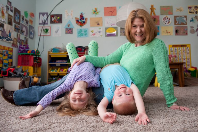 In this photo taken on Tuesday, April 8, 2014,  Wendy Lamond-Broughton and her children Bryce, 4, and Blair, 5, pose for a photo in their home in Rochester Hills, Mich. Weight Watchers has agreed to pay Lamond-Broughton $45,000 to settle a pregnancy discrimination lawsuit. The Detroit News reports that Lamond-Broughton joined Weight Watchers and lost 30 pounds following the birth of her first child and sought a job at the weight-loss company. She says she was told in September 2009 that she couldn't be hired, however, because she was pregnant again. In a statement Tuesday, the company said it has employed a workforce of primarily women for more than 40 years, including many who were pregnant. Court records show WW Group denies discrimination allegations and made no admission of liability. (AP Photo/Detroit News, David Guralnick)  DETROIT FREE PRESS OUT; HUFFINGTON POST OUT, MAGS OUT, MANDATORY CREDIT