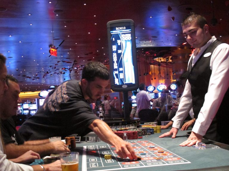 In this May 21, 2012 photo, a dealer watches as gamblers place bets on a roulette table at Revel Casino Hotel in Atlantic City, N.J. Revel filed for bankruptcy June 19, 2014, for the second time in little over a year, and warned that it might shut down if a buyer can't be found in bankruptcy court. (AP Photo/Wayne Parry)