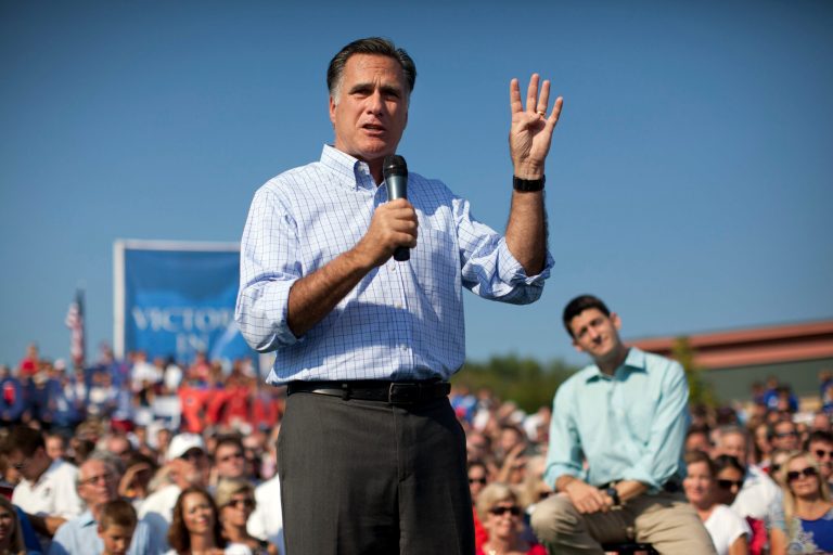 Republican presidential candidate, former Massachusetts Gov. Mitt Romney speaks as vice presidential running mate Rep. Paul Ryan, R-Wis., listens during a campaign rally on Saturday, Aug. 25, 2012 in Powell, Ohio.  (AP Photo/Evan Vucci)