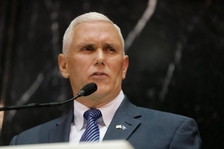 Indiana Gov. Mike Pence delivers his State of the State address to a joint session of the legislature at the Statehouse in Indianapolis, Tuesday, Jan. 13, 2015. (AP Photo/Michael Conroy)
