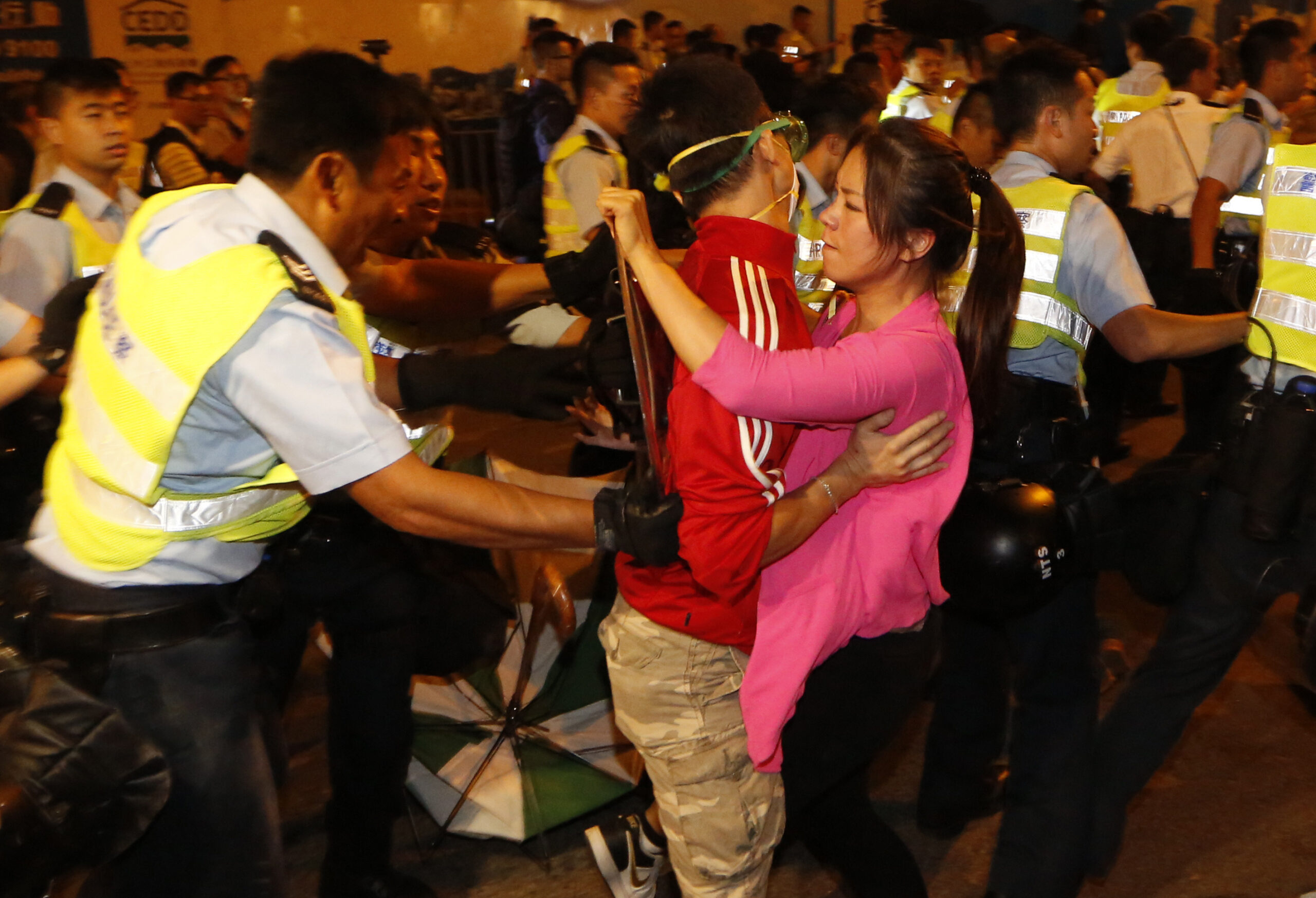 Hong Kong police drag activists away, clear tunnel