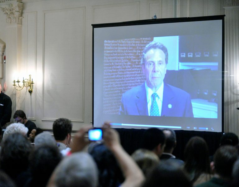 New York Working Families watch Gov. Andrew Cuomo's video speech to the party's convention in Albany, N.Y., Saturday, May 31, 2014. (AP Photo/Hans Pennink)