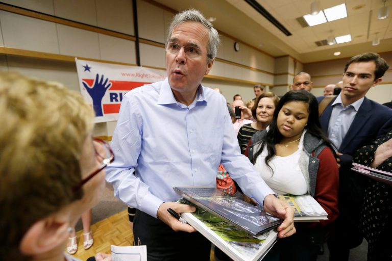 Former Florida Gov. Jeb Bush signs autographs following a town hall meeting, Saturday, May 16, 2015, at Loras College in Dubuque, Iowa. (AP Photo/Charlie Neibergall)