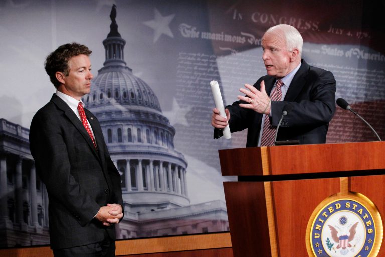 Sen. John McCain, R-Ariz., right, told the New Republic that he might vote against Sen. Rand Paul, R-Ky., in a hypothetical match-up between Paul and Hillary Clinton. (AP File)