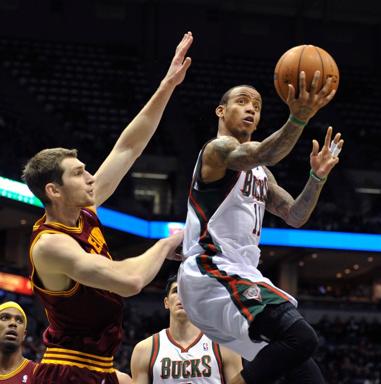   Cleveland Cavaliers' Tyler Zeller left, defends as Milwaukee Bucks Monta Ellis drives to the basket during the second half of an NBA basketball game Saturday, Dec. 22, 2012, in Milwaukee. The Cavaliers defeated the Bucks 94-82. (AP Photo/Jim Prisching)  