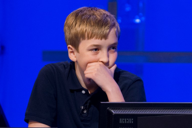 Nick Rommel, 12, of Lexington, Mass., competes in the finals of the National Geographic Bee, Wednesday, May 21, 2014, at the National Geographic Society in Washington. (AP Photo/Jacquelyn Martin)