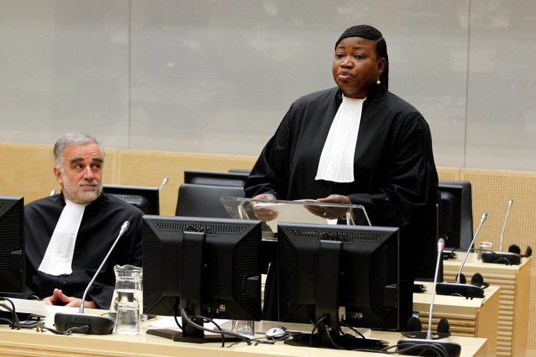   Luis Moreno-Ocampo, left, listens, as new prosecutor Fatou Bensouda, right, is holding her first speech as new prosecutor after a swearing-in ceremony at The International Criminal Court (ICC) in The Hague, Netherlands, Friday, June 15, 2012. The ICC installed Gambian war crimes lawyer Fatou Bensouda as its new prosecutor for a nine-year term on Friday. Bensounda replaces Luis Moreno-Ocampo. She will be tasked with trying to bring to justice alleged war criminals including Uganda's Joseph Kony, Libya's Seif al-Islam Gadhafi and Sudanese president Omar al-Bashir. (AP Photo/Bas Czerwinski, Pool)  