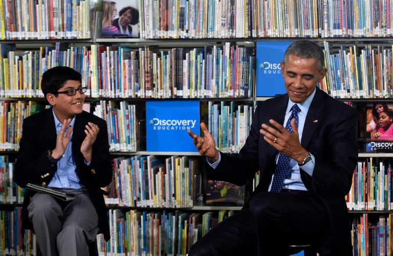 President Barack Obama reacts after being thanked by sixth-grader Osman Yaya, left, a student at Wicomico County Public Schools' Bennett Middle School in Salisbury, Md. (AP Photo)Â 