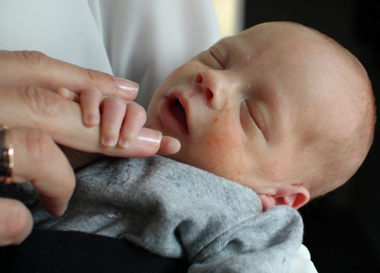 Vincent, the first baby born to a woman who had a womb transplant, is cradled by his mother at an undisclosed location in Sweden, Monday, Oct. 6, 2014. The parents of the baby say they hope they can be an inspiration to others struggling with infertility. After what they describe as a rollercoaster of a journey, the unnamed Swedish couple finally became parents last month, when the mother gave birth to a healthy but premature baby boy. (AP Photo/Ben Jary)