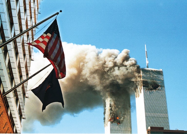 Smoke Pours From The World Trade Center After Being Hit By Two Planes September 11, 2001 In New York City.  (Photo By Craig Allen/Getty Images)