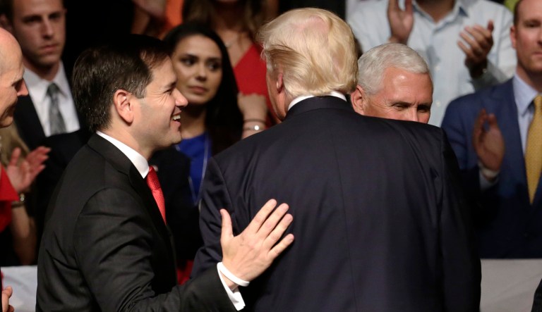 Sen. Marco Rubio, R-Fla., left, walks off the stage with President Donald Trump after a speech where Trump a revised Cuba policy aimed at stopping the flow of U.S. cash to the country's military and security services while maintaining diplomatic relations, Friday, June 16, 2017, in Miami. (AP Photo/Lynne Sladky)