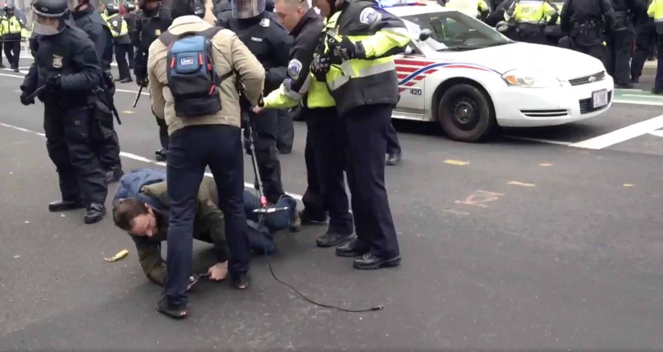 Cops push Washington Post reporter to ground