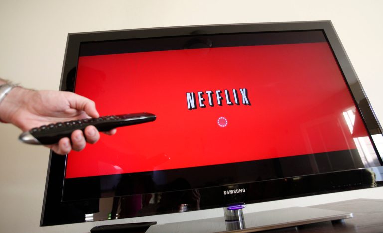FILE - In this July 20, 2010 file photo, a Netflix customer uses Netflix in Palo Alto, Calif. Netflix will pay Verizon Communications to help clear up some of the congestion that has been bogging down its Internet video service. The deal marks the second time in less than three months that Netflix Inc. has anted up for a more direct connection to a major Internet service, even though CEO Reed Hastings objects to having to pay for better access. (AP Photo/Paul Sakuma, File)