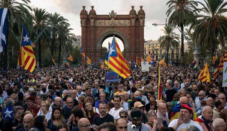 Pro-independence supporters holding Catalan flags take part in rally near the Parliament, in Barcelona, Spain, Tuesday, Oct. 10, 2017. Catalonia's President Carles Puigdemont is expected to use the results of a banned Oct. 1 referendum to justify a declaration of independence from Spain. (AP Photo/Felipe Dana)