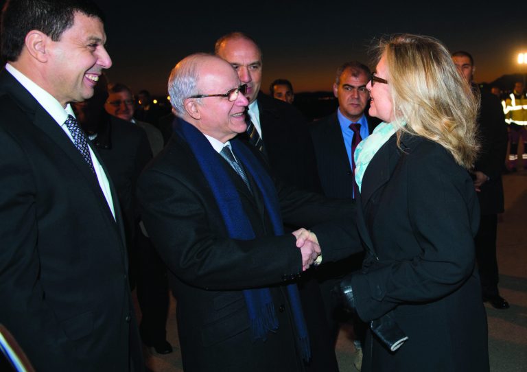 Algerian Foreign Minister Mourad Medelci, centre, greets US Secretary of State Hillary Rodham Clinton, upon her arrival at Houari Boumediene Airport, in Algiers, Algeria, Monday, Oct. 29, 2012. US Secretary Secretary of State Hillary Rodham Clinton is on a five-day trip overseas to increase pressure on Mali's al-Qaida-linked rebels and help Balkan nations end long-simmering ethnic and political disagreements. (AP Photo, Saul Loeb, Pool)