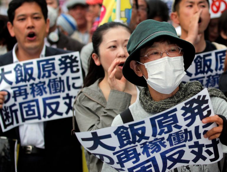   Protesters shout slogans during an anti-nuclear plant rally in front of the Prime Minister's office in Tokyo, Friday, June 8, 2012 shortly after Japanese Prime Minister Yoshihiko Noda said Japan must restart two nuclear reactors to protect the economy and people's livelihoods in a news conference. Noda said in the news conference broadcast live to the nation that the government has taken ample measures to ensure the safety of the two reactors at the Ohi nuclear plant in western Japan. The banners read 
