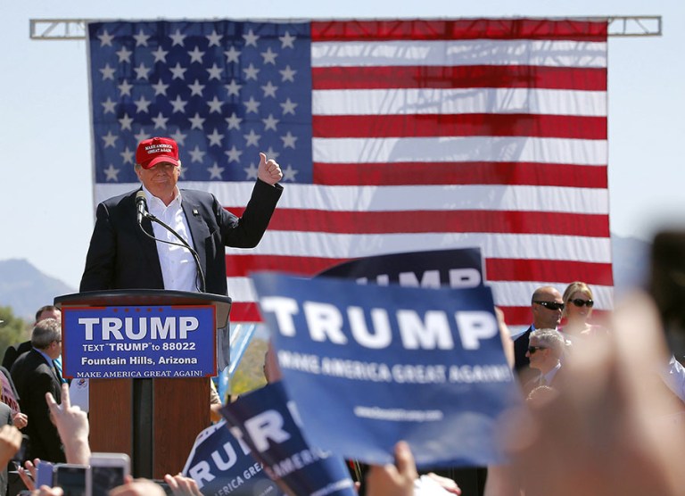 The GOP front-runner offered his standard fare of bellicose claims after the delay. (AP Photo/Matt York)