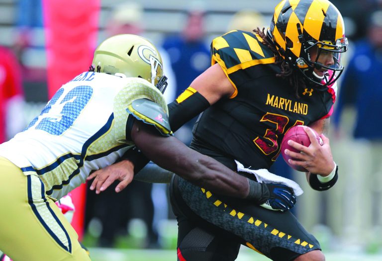 Luis M. Alvarez/AP
Converted linebacker Shawn Petty ran for 24 yards and threw for 115 and two touchdowns in his first action at quarterback.