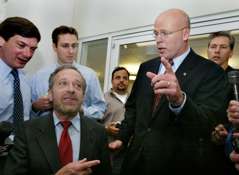 Former state Sen. Warren Tolman (right), pictured after a taped debate on Aug. 16, 2002, when he was running for governor, is now running to be Massachusetts' attorney general. (AP Photo/Julia Malakie)
