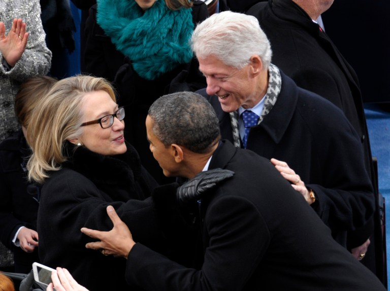 President Obama is greeted by then-Secretary of State Hillary Clinton and former President Bill Clinton for his ceremonial swearing-in on Capitol Hill in Washington, during the 57th Presidential Inauguration on Jan. 21, 2013. (AP Photo/Susan Walsh)