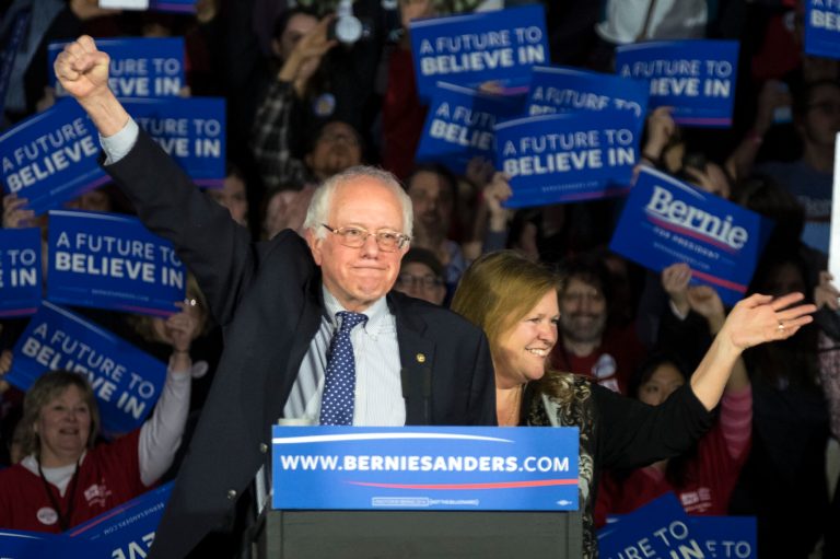 Democratic presidential candidate, Sen. Bernie Sanders, I-Vt, and his wave Jane acknowledge the crowd as he arrives for his caucus night rally in Des Moines, Iowa, Monday, Feb. 2, 2016. (AP Photo/Patrick Semansky)