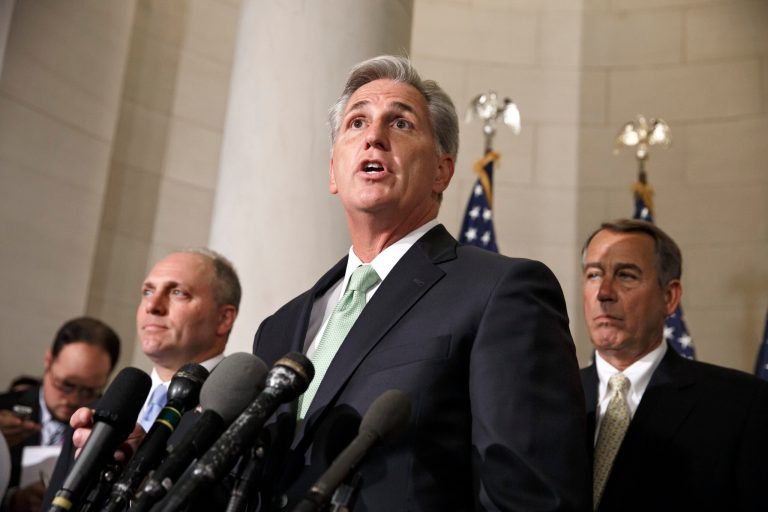 FILE - This June 19, 2014 file photo shows House Majority Whip Kevin McCarthy, R-Calif., with Rep. Steve Scalise, R-La., left, and Speaker of the House John Boehner, R-Ohio, right, on Capitol Hill in Washington just after McCarthy was voted new majority leader, replacing Rep. Eric Cantor, R-Va., who was defeated in the primary election. This year, Congress logged a confidence rating of 7 percent, the lowest Gallup has measured for any institution, ever. People talk about throwing the bums out, but voters keep sending the same bunch back in. This November, when Republicans and Democrats face off in what looks to be a dramatic midterm election, the vast majority of current lawmakers are sitting snugly in their seats. (AP Photo/J. Scott Applewhite, File)