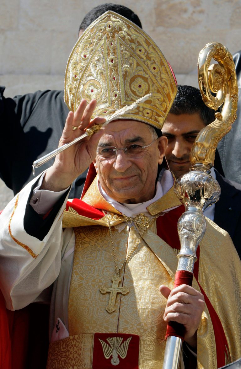 FILE - This Tuesday, March 15, 2011 file photo shows the newly elected Maronite Patriarch Bechara Rai shortly after his election at the church's seat in Bkirki, northeast of Beirut, Lebanon. A planned visit by the leader of Lebanon's largest church to Jerusalem later this month has led to a controversy in this tiny Arab country that Israel invaded in the past and occupied parts of it for more than a decade. Rai, head of the Maronite Catholic church throughout the region, will be the first leader of the Middle Eastern church to visit the Holy Land since Israel was created in 1948. Rai says he is going to welcome Pope Francis who is scheduled to visit Jordan, the West Bank and Israel from May 24 to 26, 2014. Lebanon bans its citizens from visiting Israel or having contact with Israelis. (AP Photo/Bilal Hussein, File)