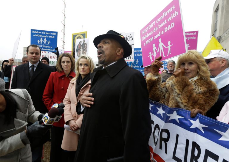 FILE - In a Tuesday, Feb. 4, 2014 file photo, former Republican candidate for lieutenant governor, E.W. Jackson, center, speaks to the media during a demonstration outside Federal Court in Norfolk, Va. Jackson spoke in favor of the law banning same sex marriage. In Virginia, Utah, Oklahoma and Kentucky, federal judges have struck down part or all of the bans on same-sex marriage that voters approved between 2004 and 2006. Each of the rulings has been stayed, pending appeals, but the trend is unsettling to the activists who oppose gay marriage. (AP Photo/Steve Helber, File)
