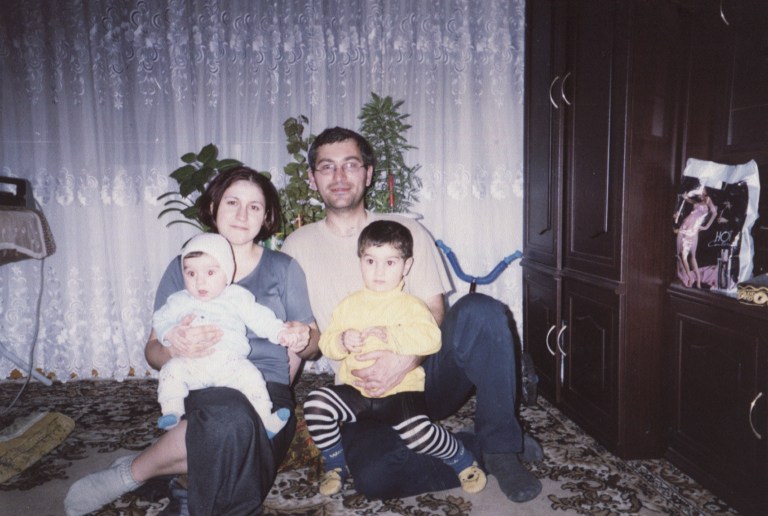   In this undated Gasanov family handout photo made avaliable on Thursday, Dec. 6, 2012, doctor Shamil Gasanov, his wife and two children pose for a photo at their home in Makhachkala, a provincial capital in Dagestan, southern Russia. Doctor Shamil Gasanov was seized and charged of organizing an attack by Islamic militants three years ago that killed the police chief in Makhachkala, a provincial capital in Russiaâs restive Caucasus. But he wonât get his days in court. His decapitated body was returned to his relatives, who say they suspect police blew his head off with a grenade launcher. (AP Photo/Gasanov Family )  