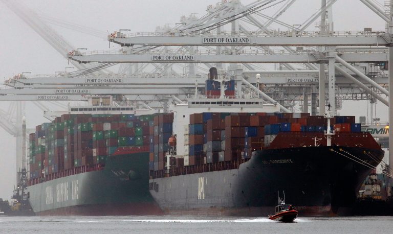 FILE - In this Wednesday, Oct. 23, 2013, file photo, container ships wait to be off-loaded in a thick fog at the Port of Oakland in Oakland, Calif. The Commerce Department reports how much wholesalers adjusted their stockpiles in October and how much their sales changed, on Tuesday, Dec. 10, 2013. (AP Photo/Ben Margot, File)