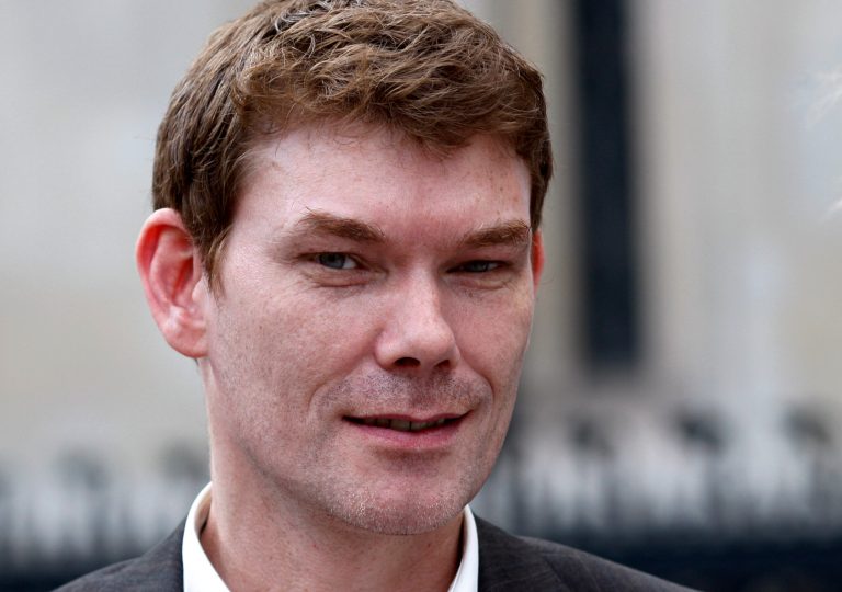   File - In this July 14, 2009 file photo Gary McKinnon, accused of hacking into U.S. military computers and facing extradition to the U.S. to stand trial, leaves the High Court in London. British authorities say Friday Dec 14 2012 theyâve opted not to charge the computer hacker who waged a decade-long struggle to avoid trial in the U.S. Prosecutors had to decide whether Gary McKinnon should be tried in Britain over alleged breaches of military and NASA networks, after he successfully fought extradition to the United States. (AP Photo/Sang Tan, File)  
