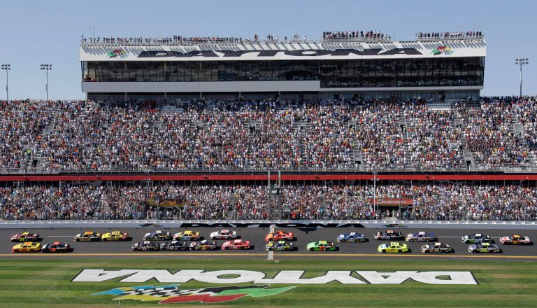 FILE - In this Feb. 20, 2011, file photo, Jeff Gordon and Kurt Busch lead the field at the start of the Daytona 500 NASCAR auto race at Daytona International Speedway in Daytona Beach, Fla. Toyota Motor Corp. is the first company to land naming rights at the revamped Daytona International Speedway. The Japanese automaker and International Speedway Corp., which owns the famous Florida track, announced the deal Thursday, Feb. 6, 2014, at the Chicago Auto Show. (AP Photo/Lynne Sladky, File)