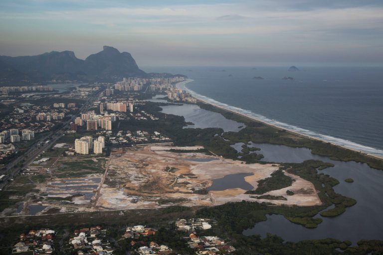 This May 13, 2014 aerial photo, shows the Rio 2016 Olympic golf course under construction in Rio de Janeiro, Brazil. Grass has been going down for several weeks at the course, which created an upbeat mood as golf prepares to return to the Olympics after a 112-year absence. That changed Saturday, May 31, 2014 when Rio organizers confirmed that a state prosecutor could halt work on the course unless the developer shows it is following environmental regulations and other requirements under Brazilian law. (AP Photo/Felipe Dana)