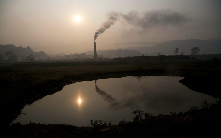 Smoke rises from a brick kiln on the outskirts of Gauhati, India. TheÂ Ex-Im Bank would help large emitters in the developing world such as India to build more solar and wind energy to reduce their electricity systems' reliance on fossil fuels, saidÂ Nigel Purvis, founder and president of Climate Advisers.Â (AP Photo/ Anupam Nath)